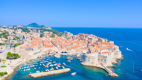 High angle view of buildings against sea