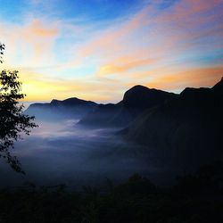 Scenic view of mountains at sunset