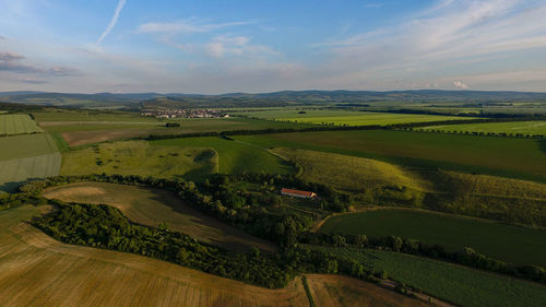 Aerial view of agricultural field against sky
