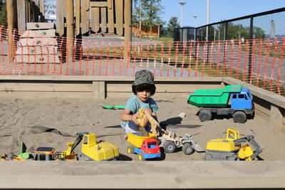 Boy playing with toy car