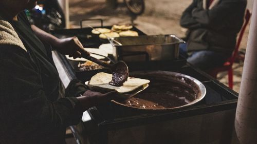 High angle view of people preparing food in restaurant