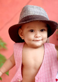 Portrait of young boy wearing hat