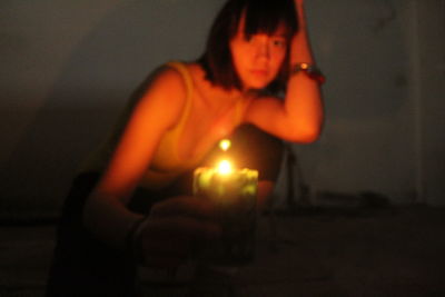 Midsection of woman with arms outstretched