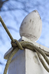 Low angle view of lamp post against the sky