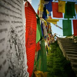 Cropped prayer flags hanging on landscape