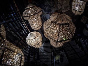 Low angle view of illuminated lanterns hanging on ceiling