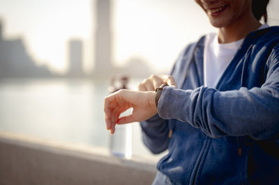 Midsection of man standing at home