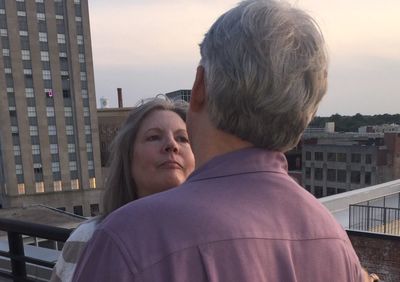 Rear view of woman looking at cityscape