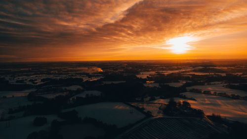 High angle view of city during sunset