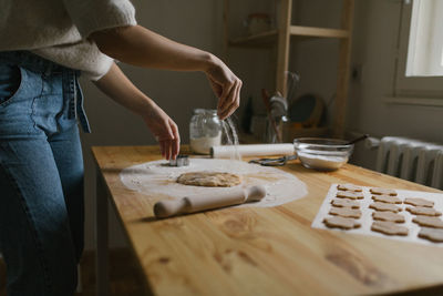 Young woman making christmas cookies