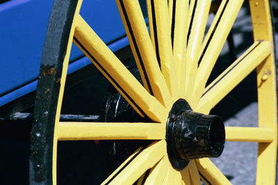 Close-up of yellow object on wooden surface