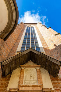 Low angle view of building against clear blue sky