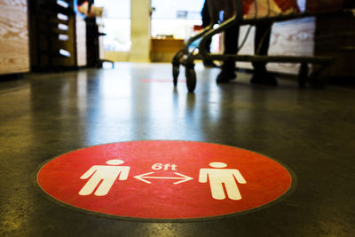 Close-up of road sign on floor