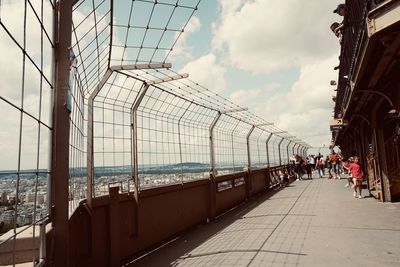 Group of people in city against sky