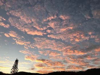 Low angle view of dramatic sky during sunset