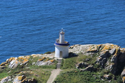 High angle view of lighthouse by sea