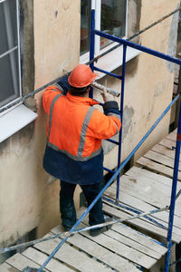 Rear view of man working