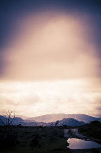 Scenic view of landscape against sky during sunset