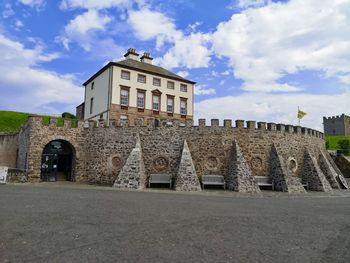 Low angle view of historical building against cloudy sky