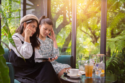 Girls drink coffee relax in cafe ,freelancer communicate on project,working business process.