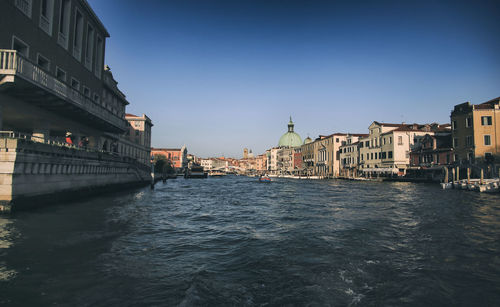 Canal passing through city buildings