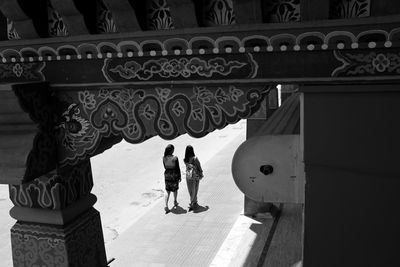 People in front of historical building