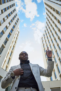 African american businessman between buildings