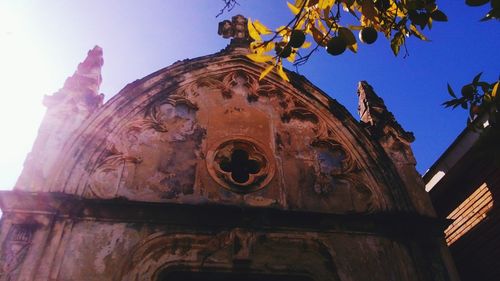 Low angle view of statue against sky