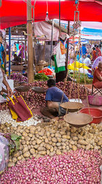 People at market stall