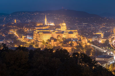 High angle view of illuminated buildings in city at night