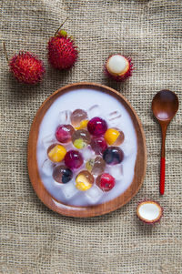 Directly above shot of fruit jelly dessert served in plate on table