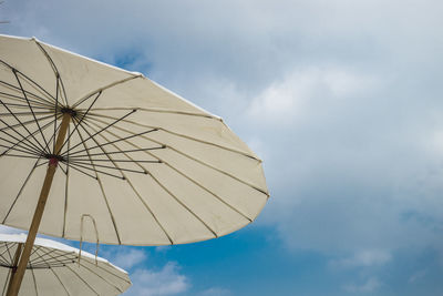 Low angle view of umbrella against sky