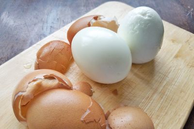 High angle view of eggs on cutting board