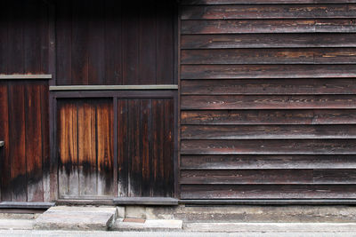 Closed wooden door of old building