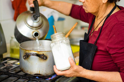 Midsection of man preparing food