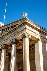 Low angle view of building against blue sky