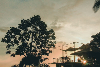 Low angle view of silhouette tree against sky at sunset