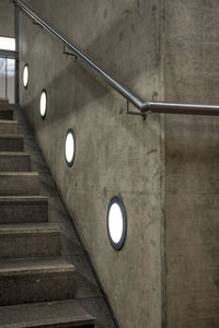 Low angle view of illuminated electric light on staircase