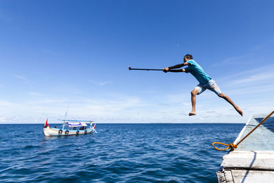 Man on sea against sky