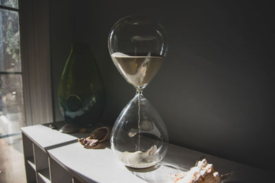 Close-up of clock on table