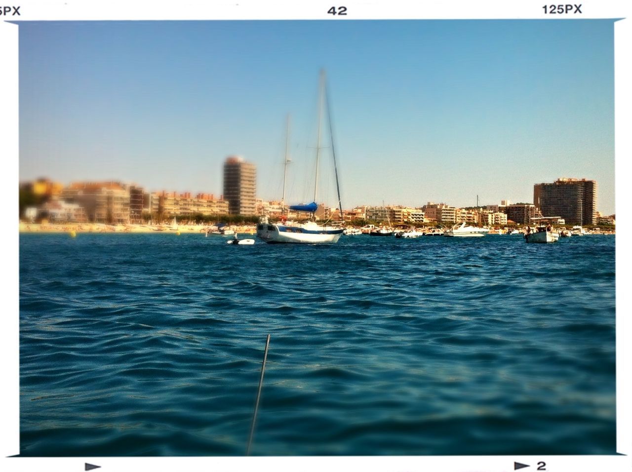 nautical vessel, water, transportation, boat, mode of transport, clear sky, sea, moored, transfer print, sailboat, waterfront, blue, harbor, copy space, mast, building exterior, river, sailing, rippled, auto post production filter