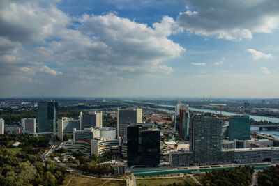 Cityscape against cloudy sky