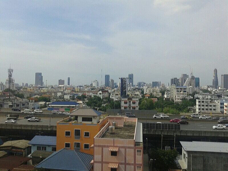 building exterior, architecture, built structure, city, cityscape, crowded, residential district, sky, residential building, high angle view, residential structure, skyscraper, tower, tall - high, city life, cloud - sky, office building, day, outdoors, building