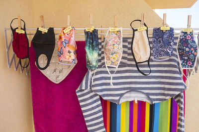 Protective face masks hanging on clothesline