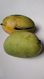 Close-up of bananas against white background