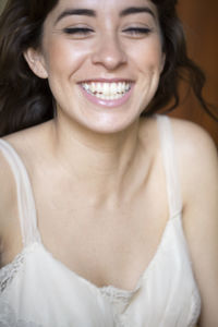 Close-up portrait of smiling young woman