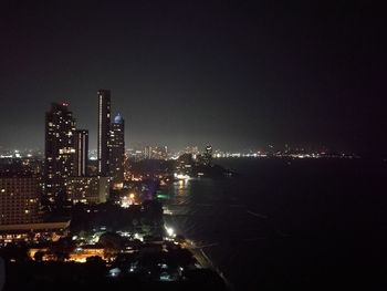 Aerial view of city lit up at night