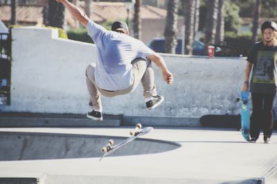 Rear view of man skateboarding