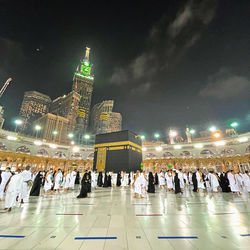 Group of people in illuminated building at night