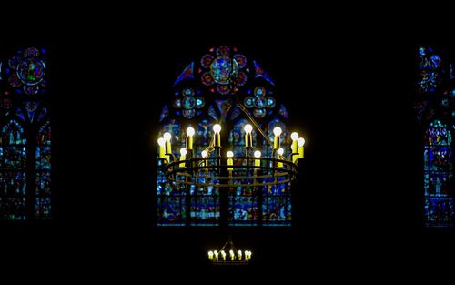 Illuminated chandelier in church
